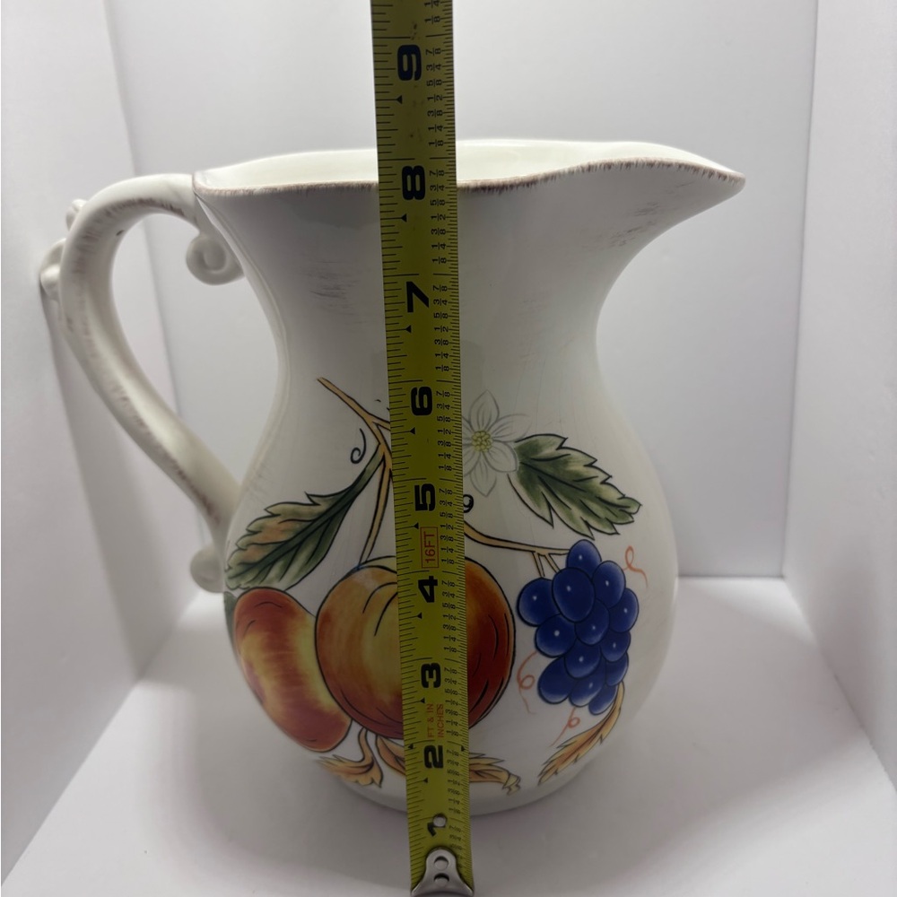 White and Orange Ceramic Art with Fruit Motifs - Picture 6 of 6